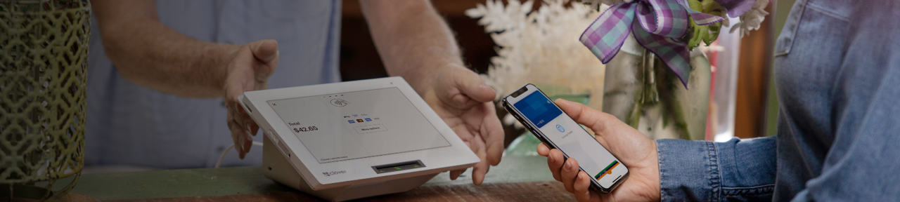 Person Using Mobile Phone to Pay for Purchase