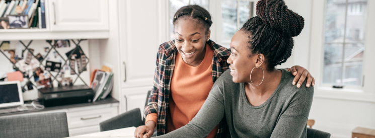 Mother and daughter exploring investment options