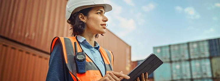 Woman wearing hard hat on construction site