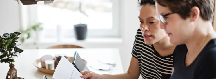 Couple reviewing credit card statements to manage debt