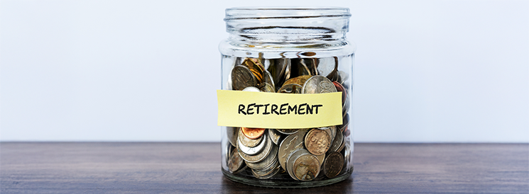 Glass jar with coins labelled retirement