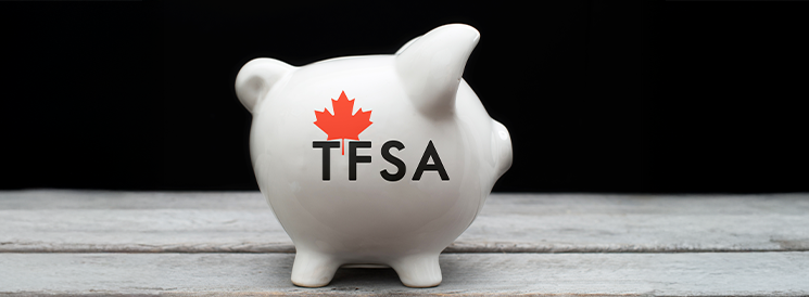 White piggy bank with red maple leaf and TFSA label